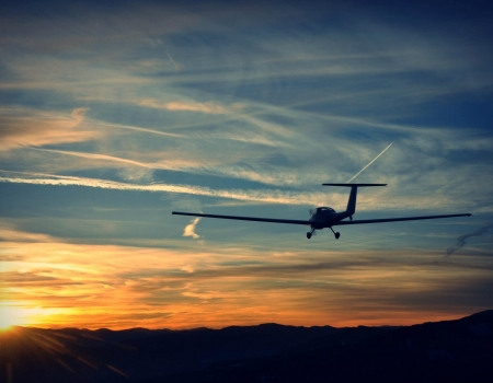 Grob 109B Aircraft in flight during sunset