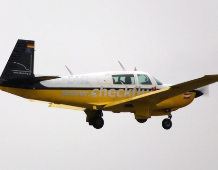 Mooney M20K in flight